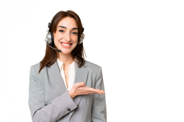 Telemarketer caucasian woman working with a headset over isolated chroma key background presenting an idea while looking smiling towards