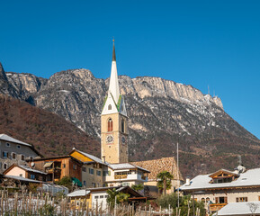 Fototapeta na wymiar The Gothic church dedicated to St. Anthony of Padua gives its name to the district of Sant’Antonio in Caldaro, South Tyrol, northern Italy