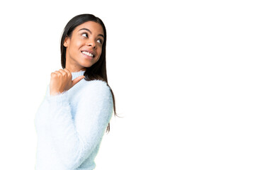 Young African American woman over isolated chroma key background pointing to the side to present a product