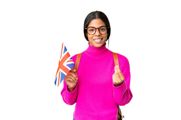 Young African American woman holding an United Kingdom flag over isolated chroma key background making money gesture