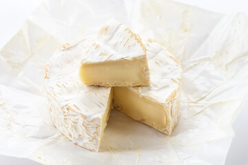 Camembert cheese on white background.