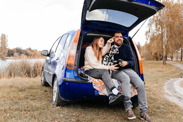 Happiness couple and their dog traveling together.