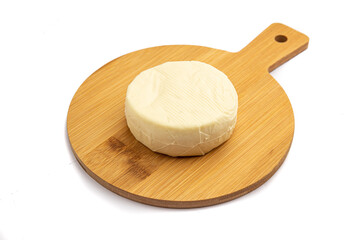 Whole cheese on a board