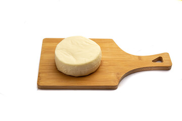 Whole cheese on a board