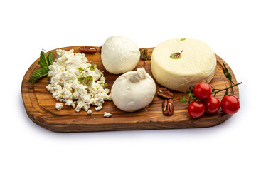 Assorted cheeses on a board with honey and jam