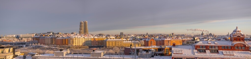 Fototapeta na wymiar Panorama, the district Vasa Stan, apartment houses and skyscrapers snowy roofs a snowy blech winter day in Stockholm