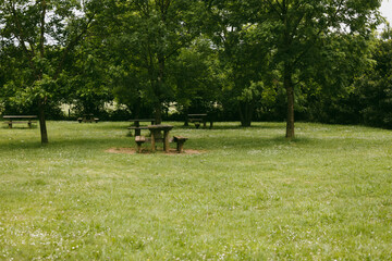 Wooden seats in a deserted park.