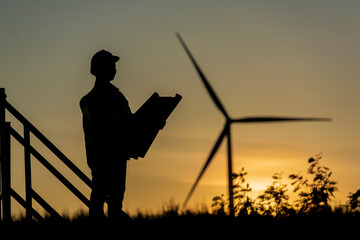silhouette of a person with Wind turbine. silhouette of a person - obrazy, fototapety, plakaty