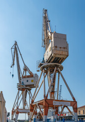 Fototapeta na wymiar Dockside cranes in Imperia