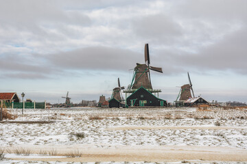 View of traditional Dutch windmills in the small village of Zaanse Schans - 554673066