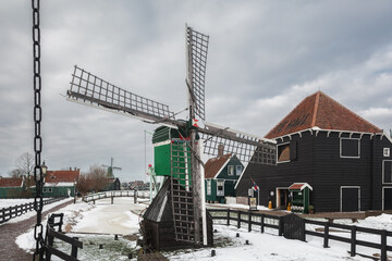An old water mill, a traditional symbol of the Netherlands. - 554673201