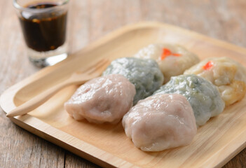 Steamed Chinese Chives Bun on wooden plate, Garlic chives with sauce