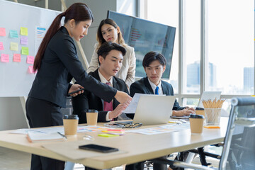 A group of young Asian businessmen Talking and planning work happily and have fun. at the company's office