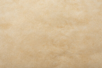 Background of brown parchment or craft paper. Old baking paper