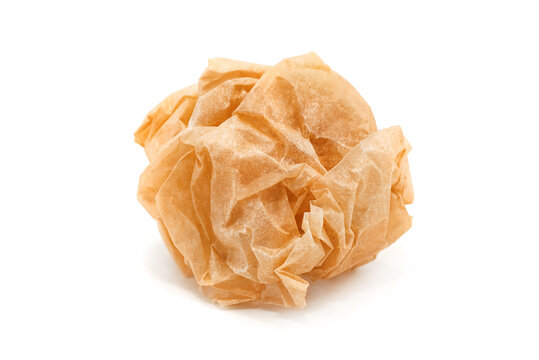 lump of crumpled brown Kraft paper isolated on a white background