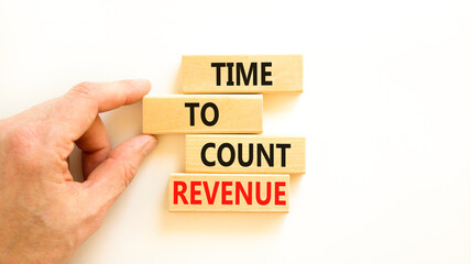 Time to count revenue symbol. Concept word Time to count revenue on wooden blocks. Businessman hand. Beautiful white table white background. Business and time to count revenue concept. Copy space.