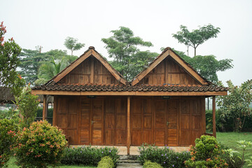 A rumah adat Jawa Tengah, also known as a rumah Joglo, is a typical dwelling in Central Java,...