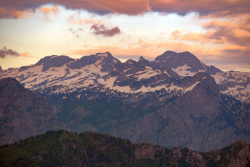 Fototapeta na wymiar Mountain landscape at sunset. Snow high in the mountains.