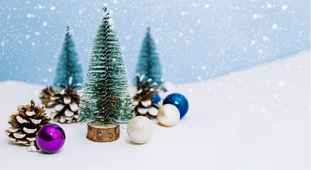 Christmas tree decor on a blue background. New Year's card with snow