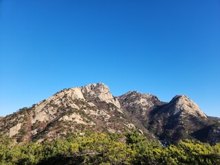 magnificent mountain landscape. Hiking and mountaineering. Mountain paths and stone steps. peak. Seasons in the mountains: autumn - winter - spring - summer. Hiking in the mountains