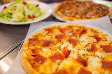 Pizza on plate on wood table with ingredients