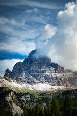 Tre Cime di Lavaredo - Side view - Dolomites - Sky and clouds - Vertical Photo