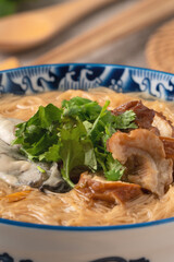 Delicious oyster and intestine vermicelli in a bowl