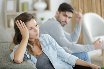 unhappy couple not talking after argument at home