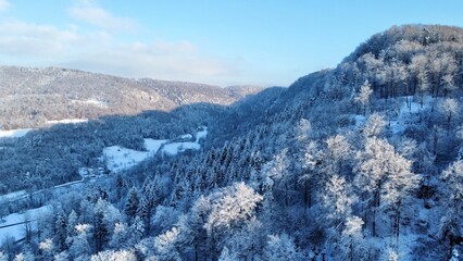snow covered mountains in winter with blue sky 