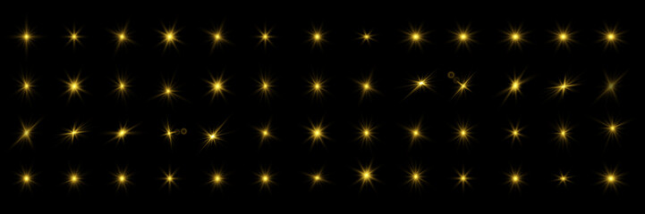 Glowing lights and stars on black background.