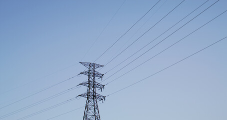 High voltage tower over the blue sky