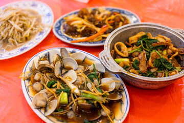 Taiwanese local cuisine with different dishes in seafood store