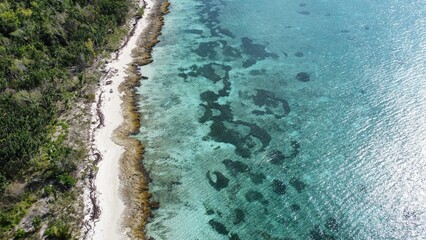 Drone shot dreamy Caribbean island blue sea