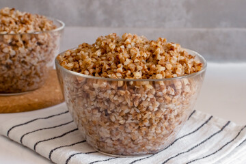 boiled buckwheat porridge in a transparent glass bowl