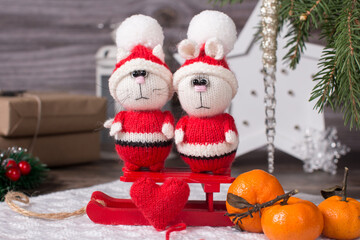 New Year's Santa Claus is a hare in a fur coat. Handmade Knitted children's toy, Christmas gift