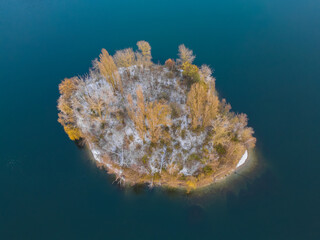 Aerial View on a little island in the quarry lake Binsfeldsee at Speyer in Germany.