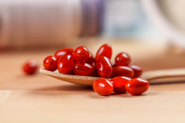 Dietary supplement pills with iron FE element. Brown capsules