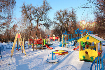 Colorful playground in winter sunny day