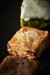 Various scones on a black background