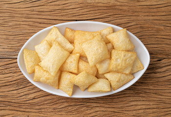 Pastel, typical brazilian finger food over wooden table
