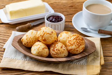 Typical brazilian cheese bun in a plate over wooden table