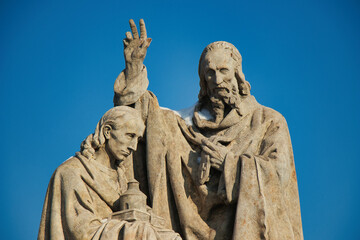 Statue of St. Cyril and St. Methodius on Charles bridge, Prague. Czech Republic.