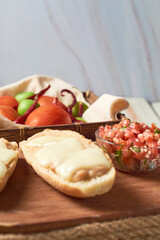 Mexican molletes on a rustic wooden board