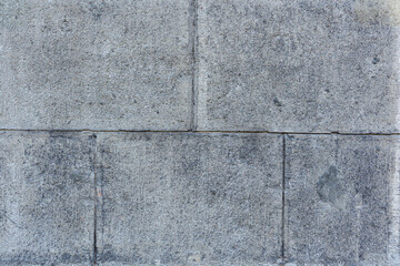 abstract gray background. city building wall made of concrete blocks