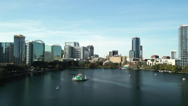 Aerial view of Downtown Orlando Florida from Lake Eola with fountain stock video establishing shot