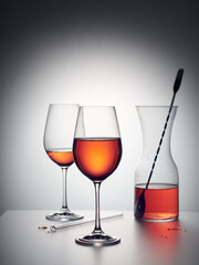 Two glasses and decanter of  wine drink.