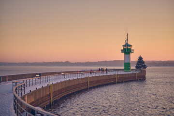 Fototapeta na wymiar Lighthouse on the Nordermole at Travemunde in northern Germany. High quality photo
