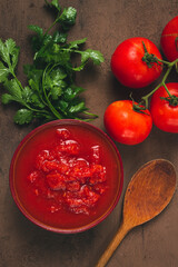 Tomatoes in their own juice, sliced, tomato sauce, tomatoes, in a cup, top view, close-up, no people,