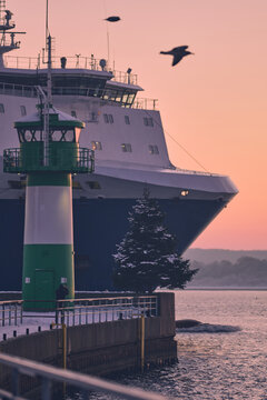 Ferry arriving at Lighthouse in Travemunde. High quality photo