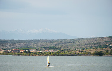 Lake Leucate in the south of France in Languedoc Roussillon in France. Windsurfing on the lake with...